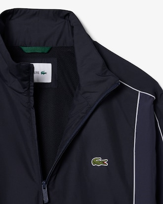 Campera  de ch&aacute;ndal hidr&oacute;fuga con bloques de color