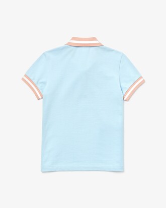 Polo infantil Lacoste em piqu&eacute; de algod&atilde;o com corte reto e detalhes listrados