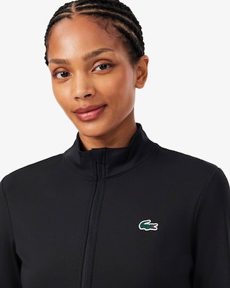 Campera deportiva intermedia de tenis el&aacute;stica con doble tejido y cierre