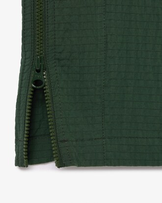 Macac&atilde;o texturizado com cinto e z&iacute;per na gola