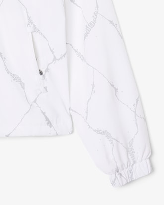 Campera de tenis con estampado de cocodrilo reflectante