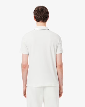 Polo Tennis Heritage con detalle de insignia Ultra Dry