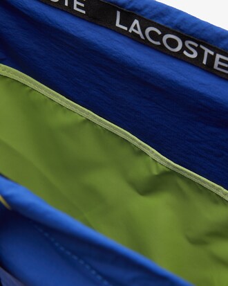 Mochila unissex dobr&aacute;vel em n&aacute;ilon com faixa assinada