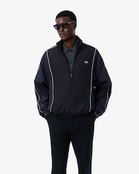 Campera  de ch&aacute;ndal hidr&oacute;fuga con bloques de color