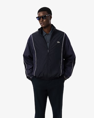 Campera  de ch&aacute;ndal hidr&oacute;fuga con bloques de color
