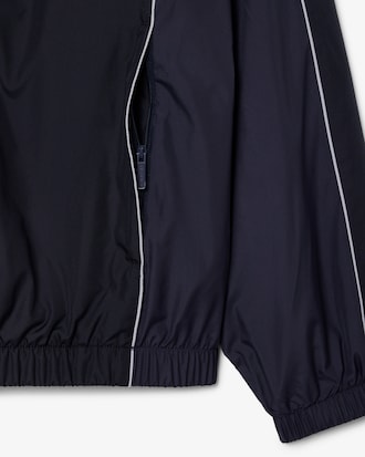 Campera  de ch&aacute;ndal hidr&oacute;fuga con bloques de color