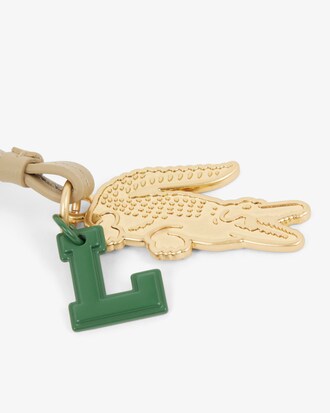Llavero con colgantes de raqueta, espejo, cocodrilo y L