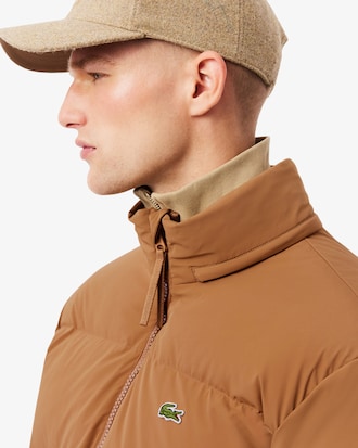 Campera de plum&oacute;n con capucha y repelente al agua
