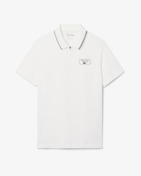 Polo Tennis Heritage con detalle de insignia Ultra Dry
