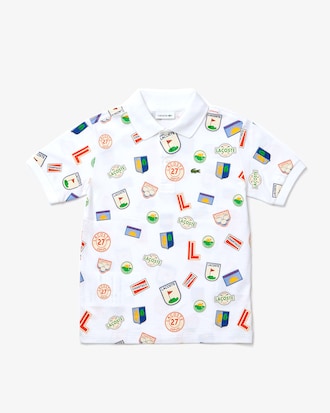 Polo infantil Lacoste em piqu&eacute; de algod&atilde;o com emblemas estampados