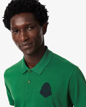 Polo de golf de piqu&eacute; mini con insignia y el&aacute;stico