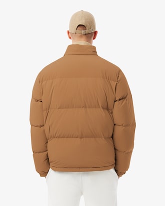 Campera de plum&oacute;n con capucha y repelente al agua