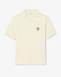 Polo de felpa de corte holgado con insignia en contraste