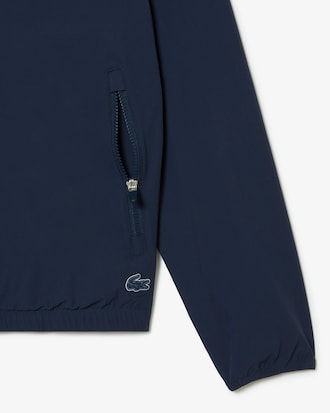 Campera corta de ch&aacute;ndal hombre Lacoste en poliamida reciclada