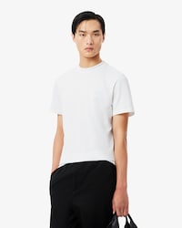 Camiseta piqu&eacute; com marca de jacquard