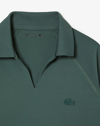 Polo cropped feminina de mangas longas